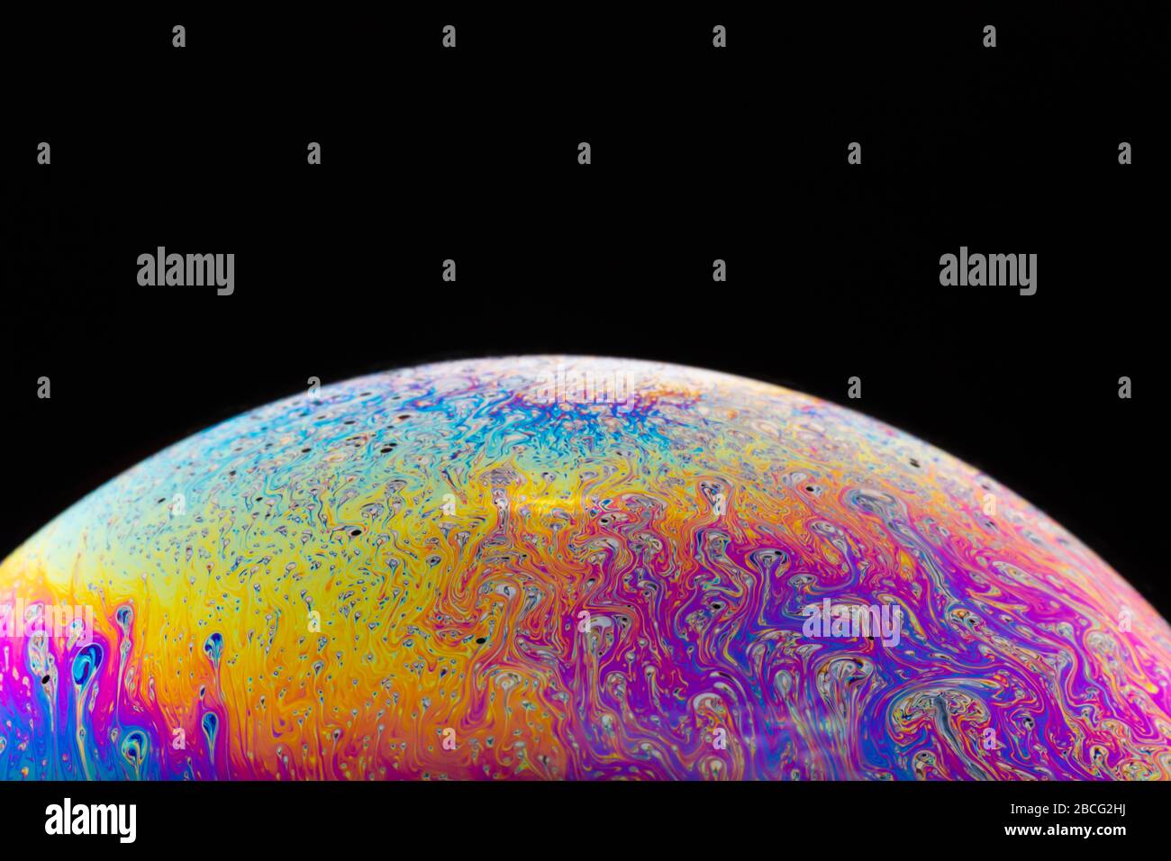 Macrophotograph of a colorful soap bubble that look like a in