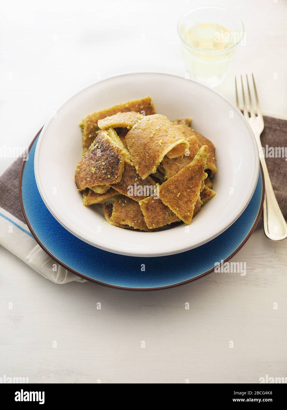 Testaroli al pesto souce, traditional ligurian pasta, Lunigiana, Ligury,  Italy, Europe Stock Photo - Alamy