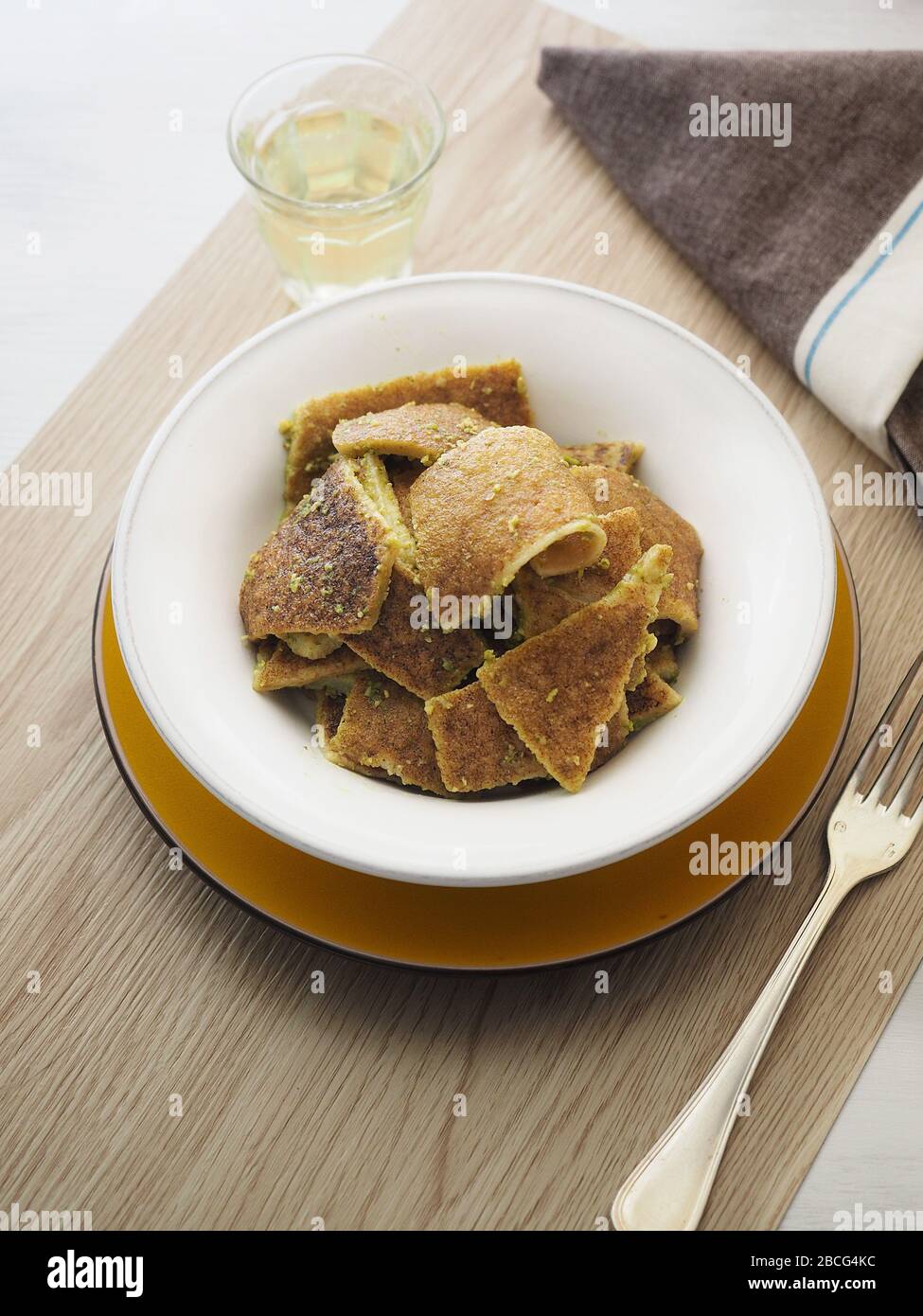 Testaroli al pesto souce, traditional ligurian pasta, Lunigiana, Ligury,  Italy, Europe Stock Photo - Alamy