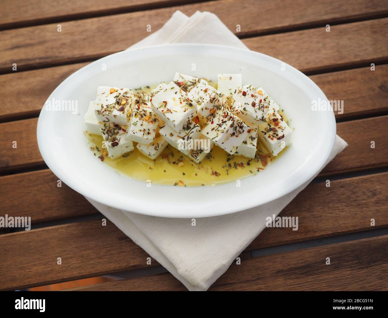 Greek feta cheese cut into cubes and seasoned with olive oil and