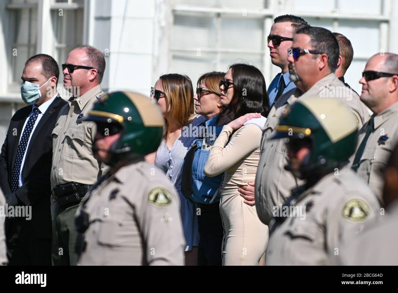 Riverside, California, USA. 3rd Apr 2020. Family members pay honor to