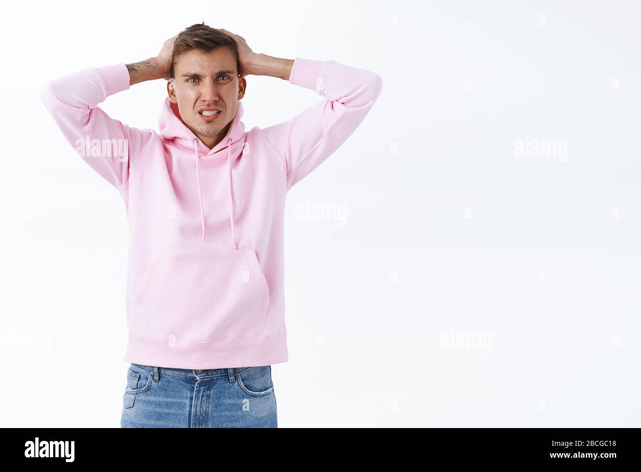 Troubled young frustrated guy got in troubled, dont know what do, shaking head in denial, grimacing disappointed, losing or failing, distressed Stock Photo