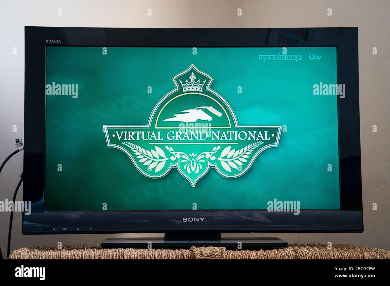 The Virtual Grand National on a TV in a flat in Wandsworth. Stock Photo