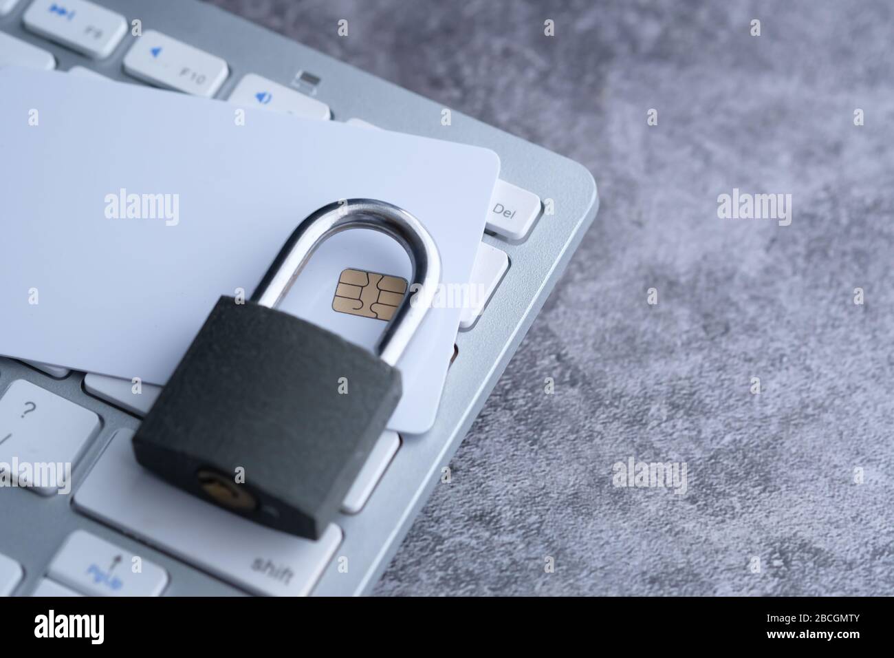 lock and credit card on the computer keyboard Stock Photo