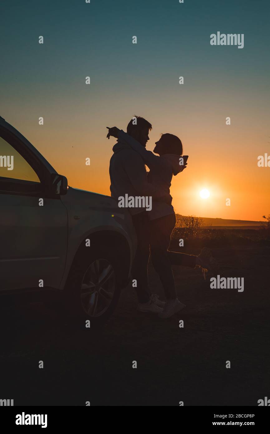 couple kissing car high resolution stock photography and images alamy https www alamy com romantic moment couple kissing on sunset near white suv car image351951958 html