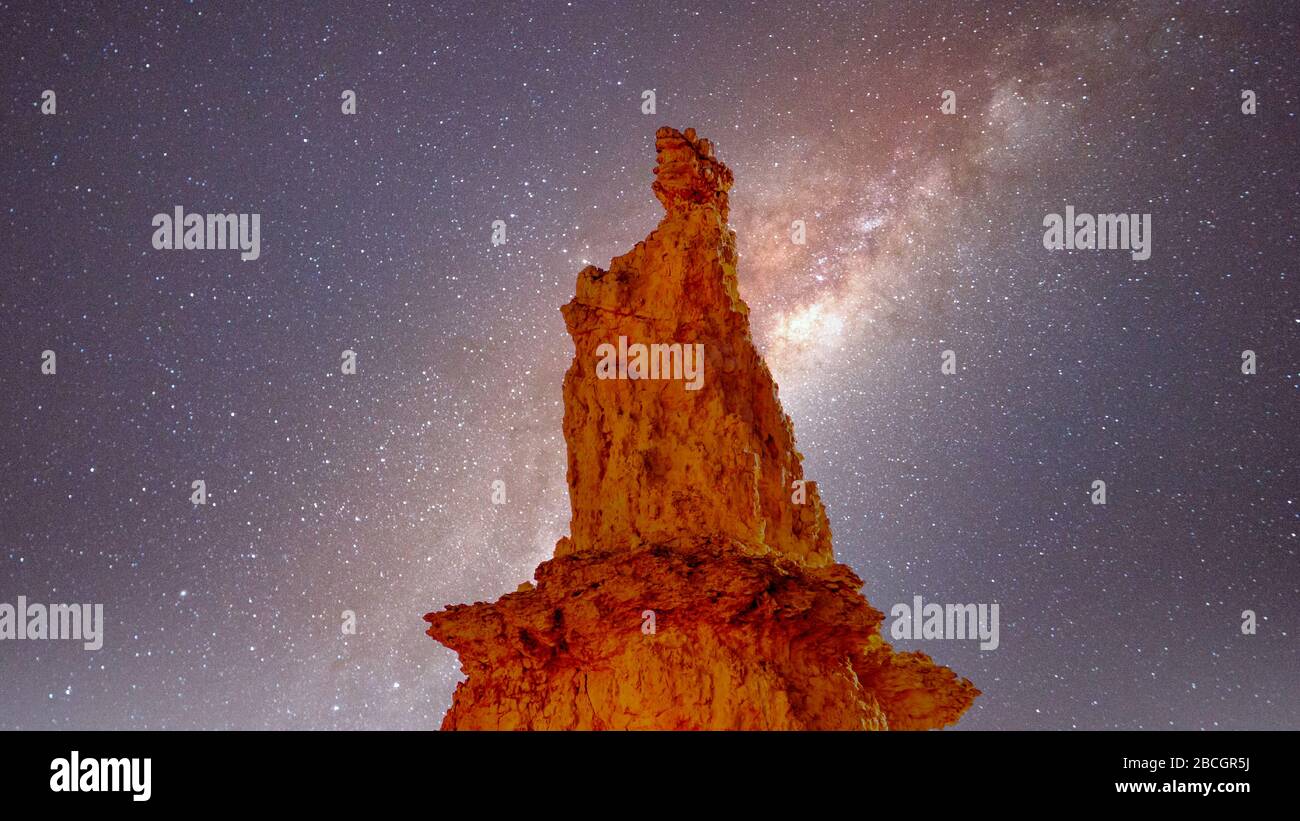 Galaxy in the night sky over the natural statue of Queen Victoria