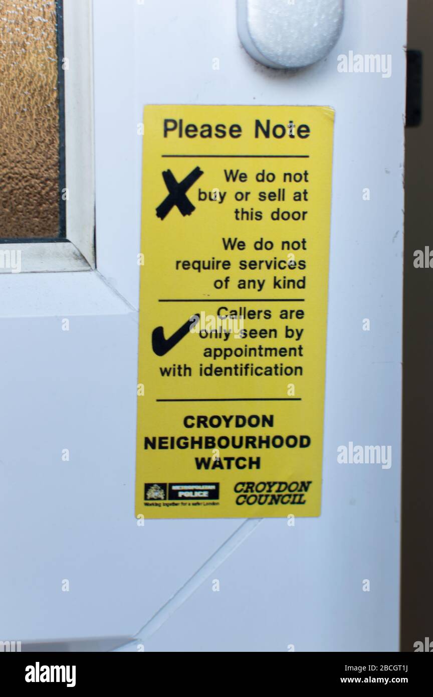 Neighborhood watch stickers on doors and windows Stock Photo