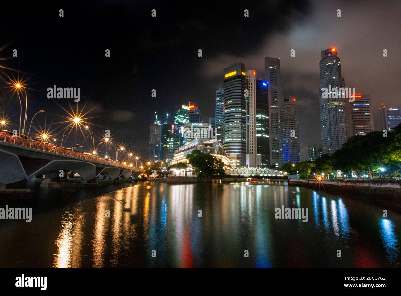 The skyline at night from the Esplanade with Marina Bay and the Central Business District in Singapore Stock Photo