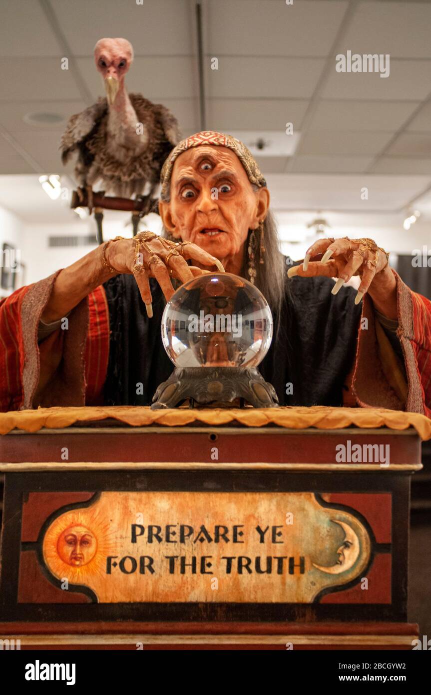 Witch fortune teller with crystal ball portrait  Society of Illustrators building, an art organization on the Upper East Side of Manhattan, New York C Stock Photo
