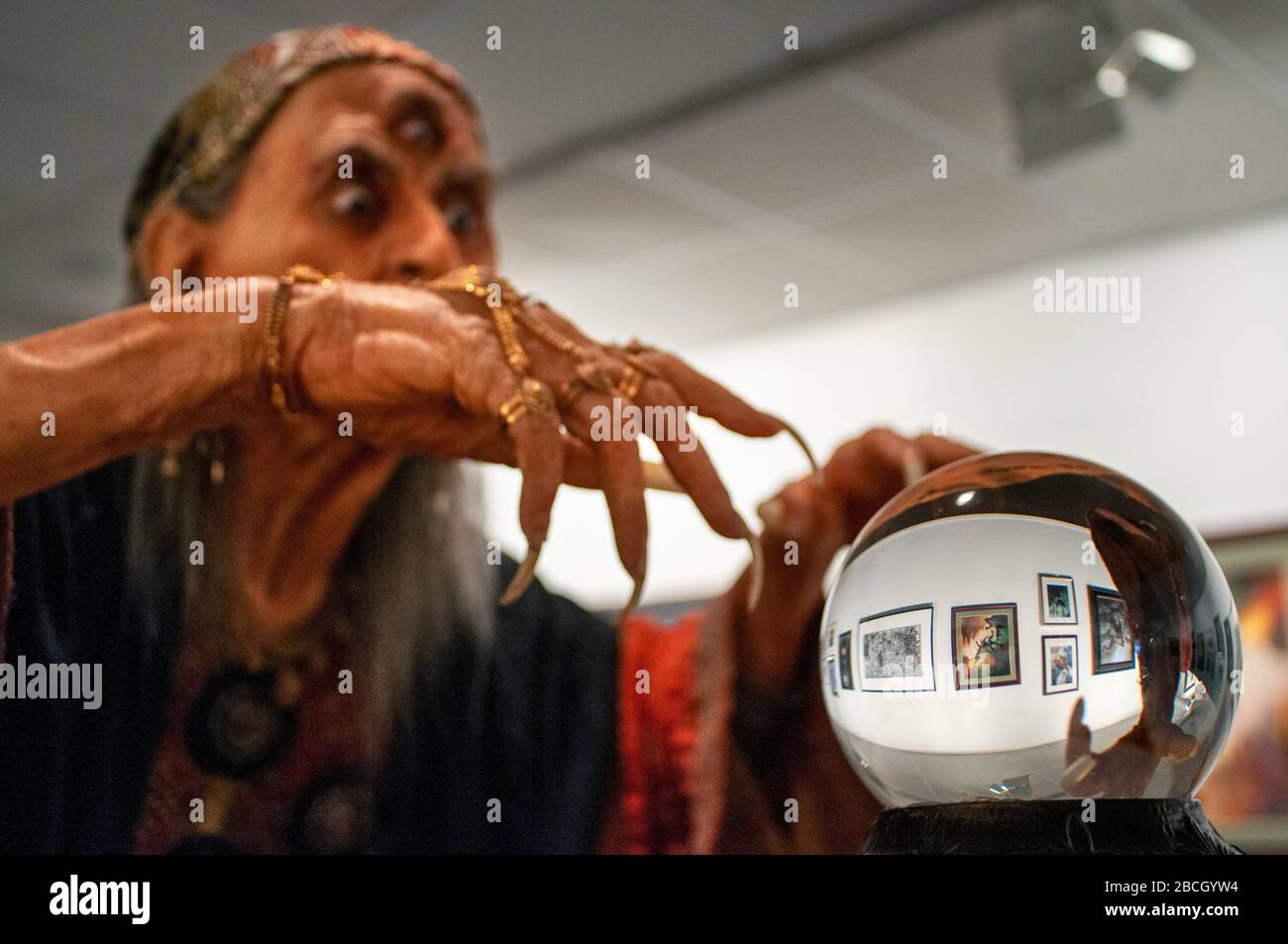 Witch fortune teller with crystal ball portrait  Society of Illustrators building, an art organization on the Upper East Side of Manhattan, New York C Stock Photo