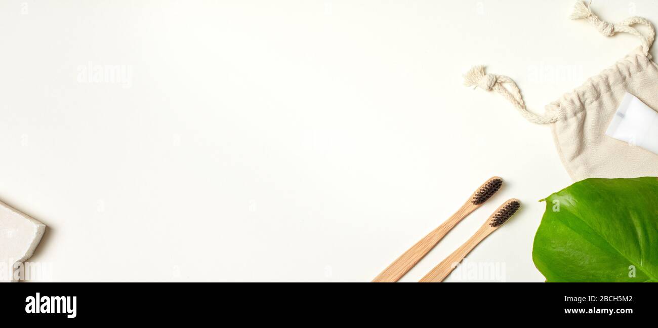 Eco-friendly Concept. Two bamboo toothbrushes and toothpaste isolated ...