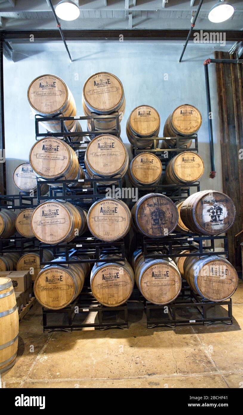 Whiskey barrels stacked on a rack at St. Augustine Distillery in St. Augustine, Florida USA Stock Photo