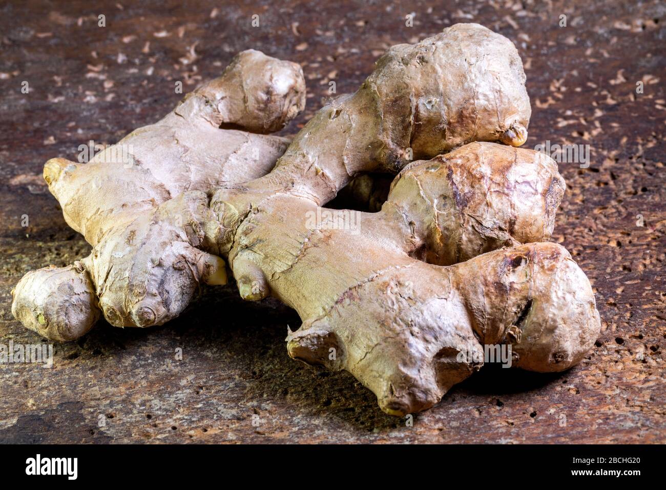 Close-up of ginger root, which is lying on the table in the kitchen Stock Photo