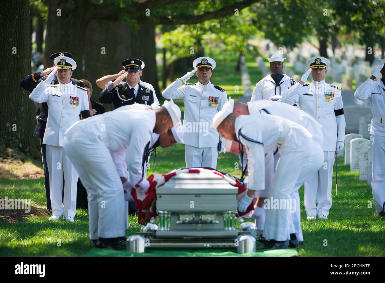 'The U.S. Navy Honor Guard participates in the graveside service for U.S. Navy Petty Officer 1st Class Xavier A. Martin at Arlington National Cemetery, Arlington, Va., Aug. 9, 2017.  Martin perished when the USS Fitzgerald (DDG 62) was involved in a collision with the Philippine-flagged merchant vessel ACX Crystal, flooding the berthing compartment he was occupying.  Martin was buried with standard honors in Section 60. (U.S. Army photo by Elizabeth Fraser / Arlington National Cemetery / released); 9 August 2017, 15:10; Funeral for U.S. Navy Petty Officer 1st Class Xavier A. Martin at Arlingto Stock Photo