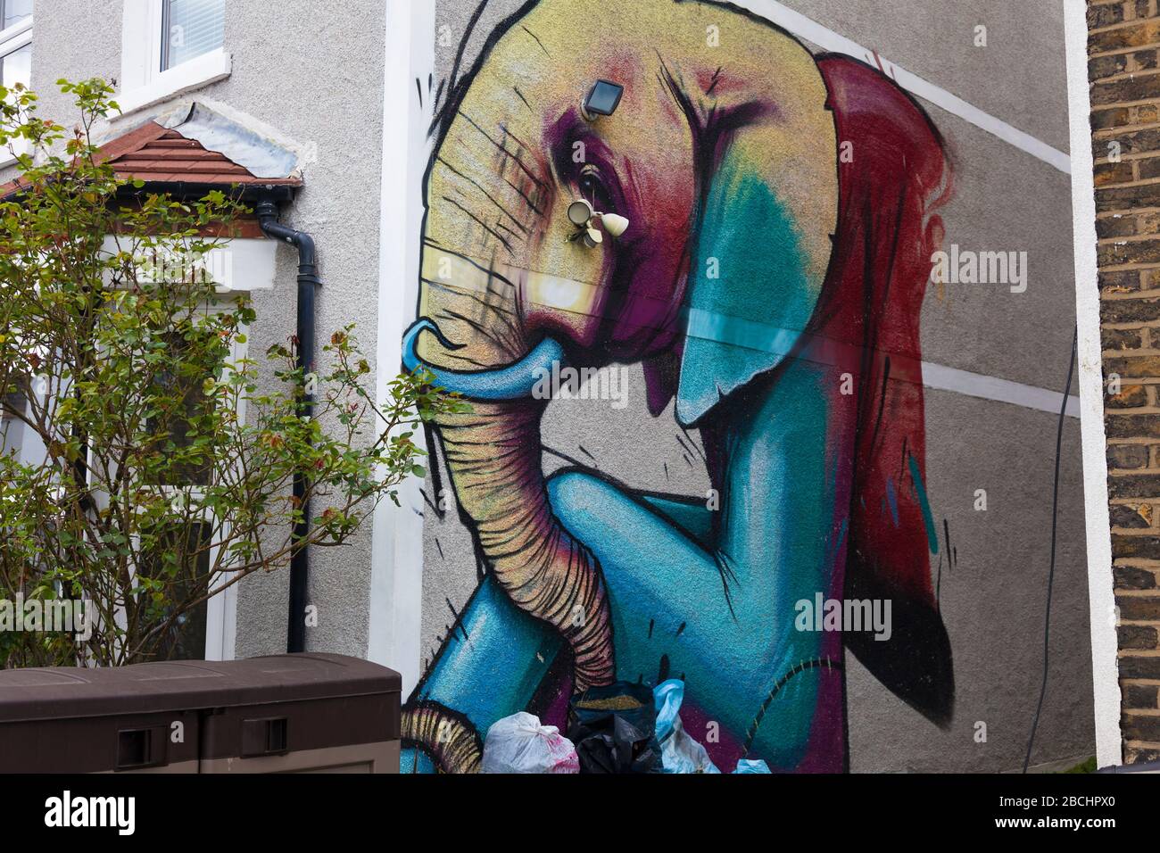 Street art on wall of a building in the back streets of Penge, South London, UK Stock Photo