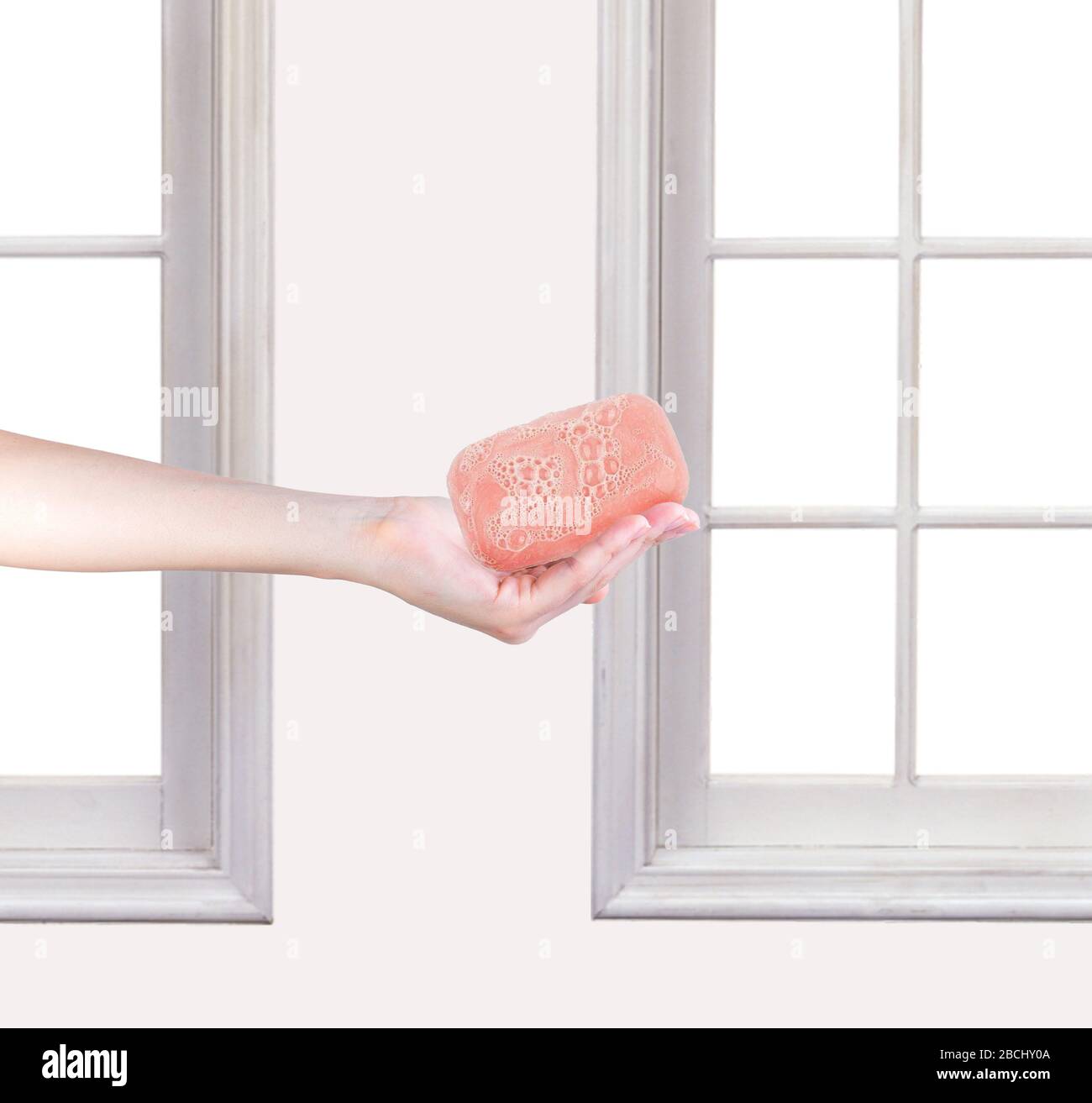 A pink soap for washing hands. inside the house. Stock Photo