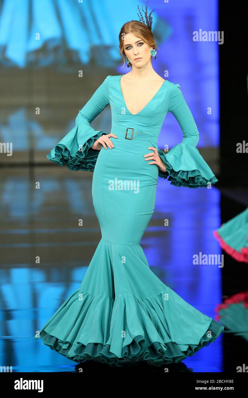 SEVILLA, SPAIN - JAN 30: model Claudia Saez wearing a jade green dress from the Grasse collection of designer Fran Solis during the SIMOF 2020 (Photo credit: Mickael Chavet) Stock Photo