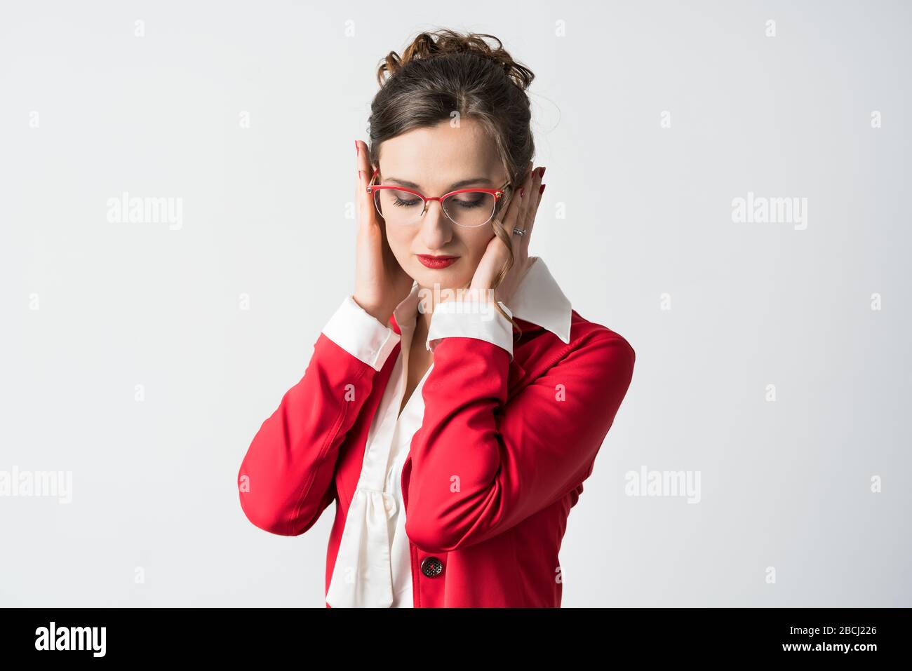 Businesswoman hear no evil Stock Photo