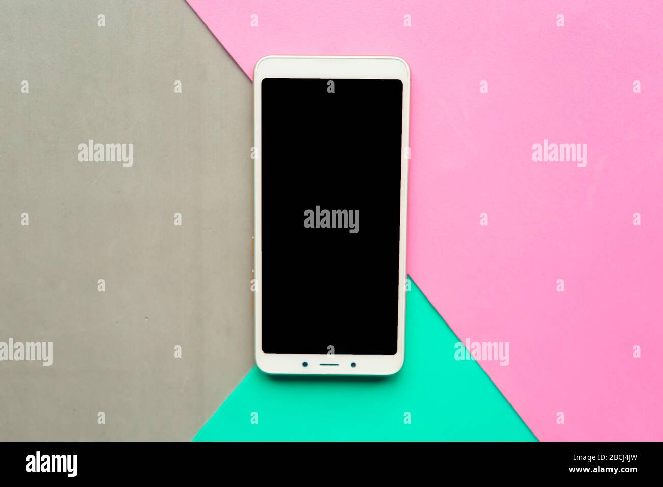 Download Mockup Phone On Geometric Pink Gray And Green Paper Background Stock Photo Alamy PSD Mockup Templates