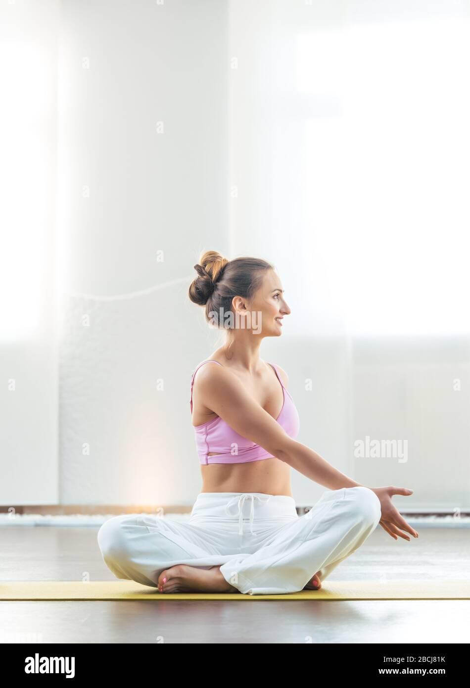 Yoga instructor showing poses in her class Stock Photo