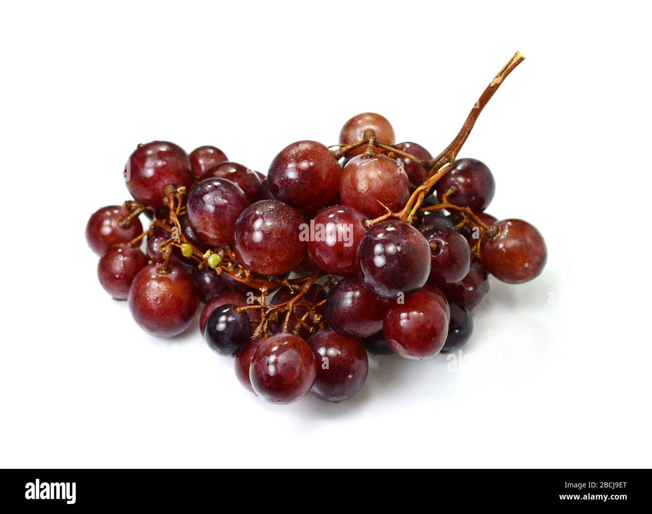A bunch of overripe grapes isolated on white background Stock Photo - Alamy
