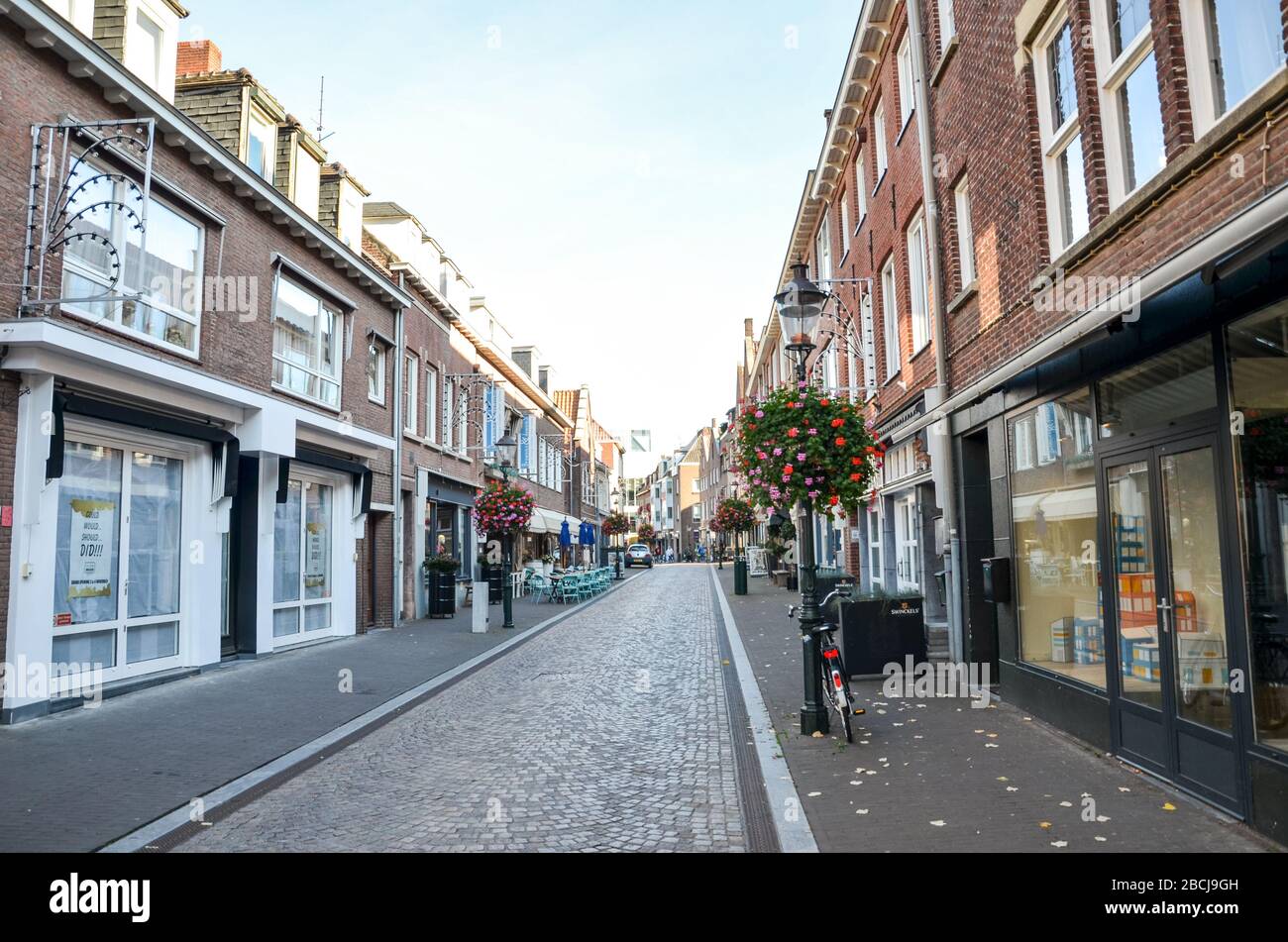 Venlo, Limburg, Netherlands - October 13, 2018: Empty street with no people in the historical center of the Dutch city. Closed shops, restaurants, and cafes. Stock Photo