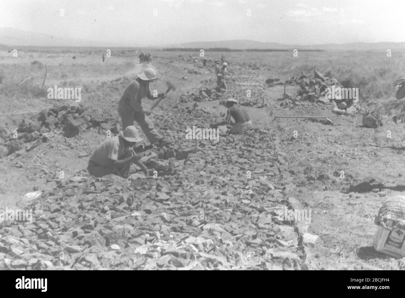 'English: KIBBUTZ MAOZ HAIM MEMBERS LAYING THE FOUNDATION OF A ROAD BETWEEN MAOZ HAIM & MOSHAV BEIT YOSSEF IN THE BEIT SHEAN VALLEY. ◊ó◊ú◊ï◊¶◊ô◊ù, ◊ó◊ë◊®◊ô ◊ß◊ô◊ë◊ï◊• ◊û◊¢◊ï◊ñ ◊ó◊ô◊ô◊ù, ◊°◊ï◊ú◊ú◊ô◊ù ◊õ◊ë◊ô◊© ◊ë◊ô◊ü ◊û◊¢◊ï◊ñ ◊ó◊ô◊ô◊ù ◊ú◊ë◊ô◊ü ◊û◊ï◊©◊ë ◊ë◊ô◊™ ◊ô◊ï◊°◊£ ◊ë◊¢◊û◊ß ◊ë◊ô◊™ ◊©◊ê◊ü.; 13 June 1939; This is available from National Photo Collection of Israel, Photography dept. Goverment Press Office (link), under the digital ID D13-076.This tag does not indicate the copyright status of the attached work. A normal copyright tag is still required. See Commons:Licensing for more information. Stock Photo