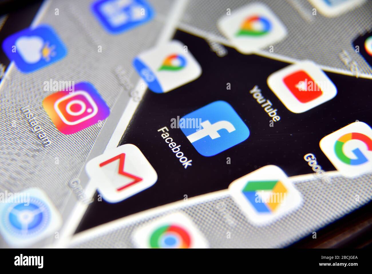 Valverde (CT), Italy - April 04, 2020: Close-up view of Facebook icon app on an Android smartphone, including other icons. Stock Photo