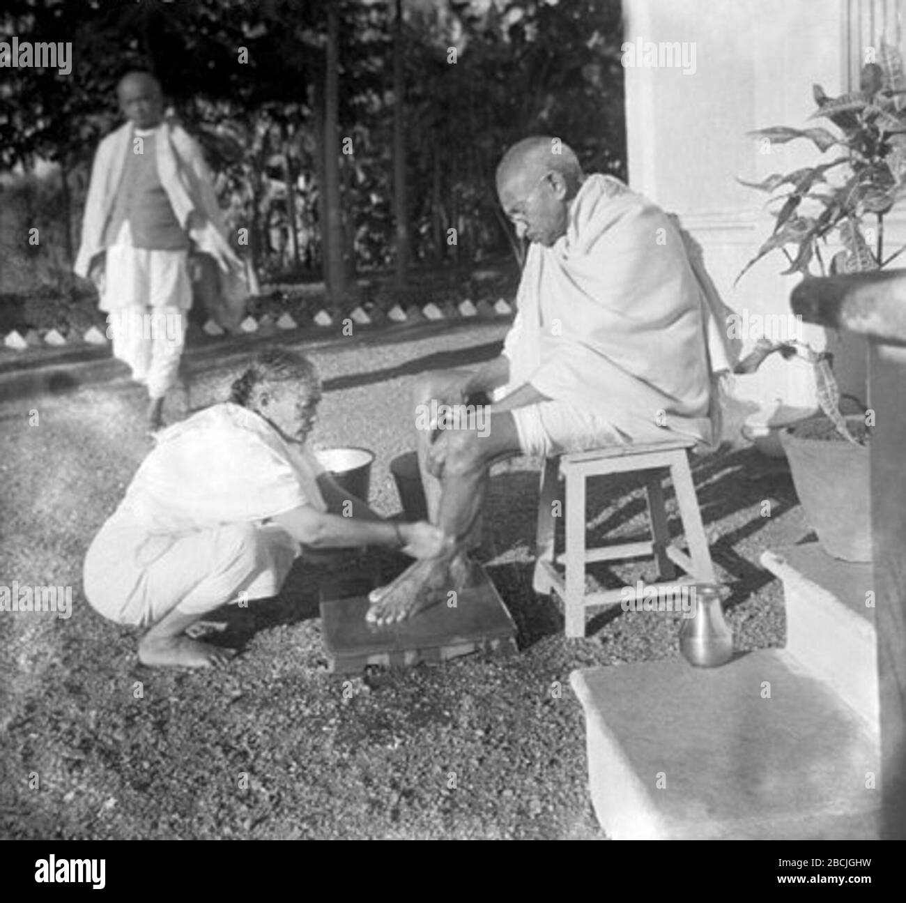 'Kasturba washing Gandhi's feet.; 1930s date QS:P,+1930-00-00T00:00:00Z/8; http://www.dinodia.com/photos/MKG-33198.jpg; Unknown author; ' Stock Photo