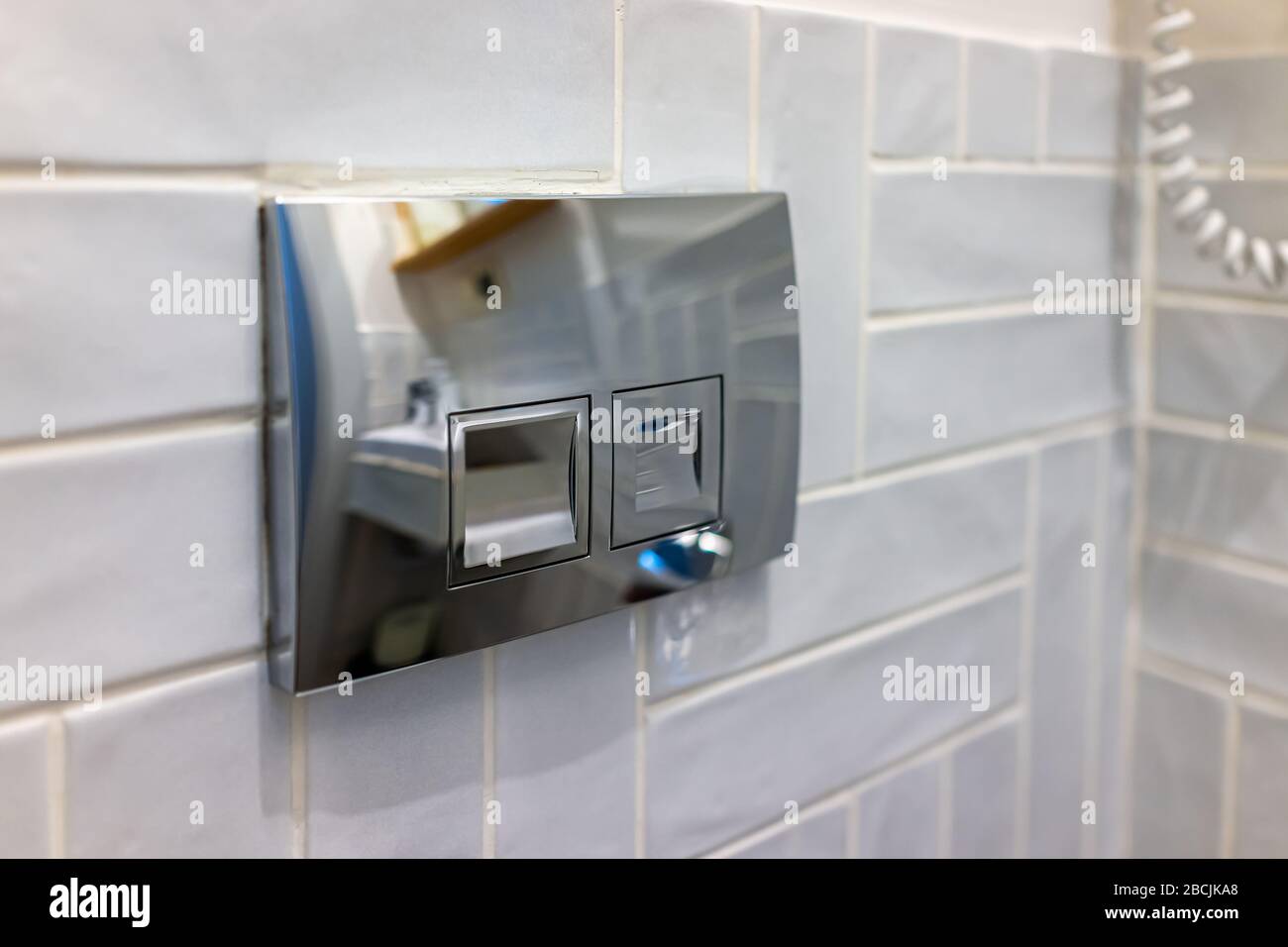 Modern bathroom stainless steel metal light switch with reflection ...