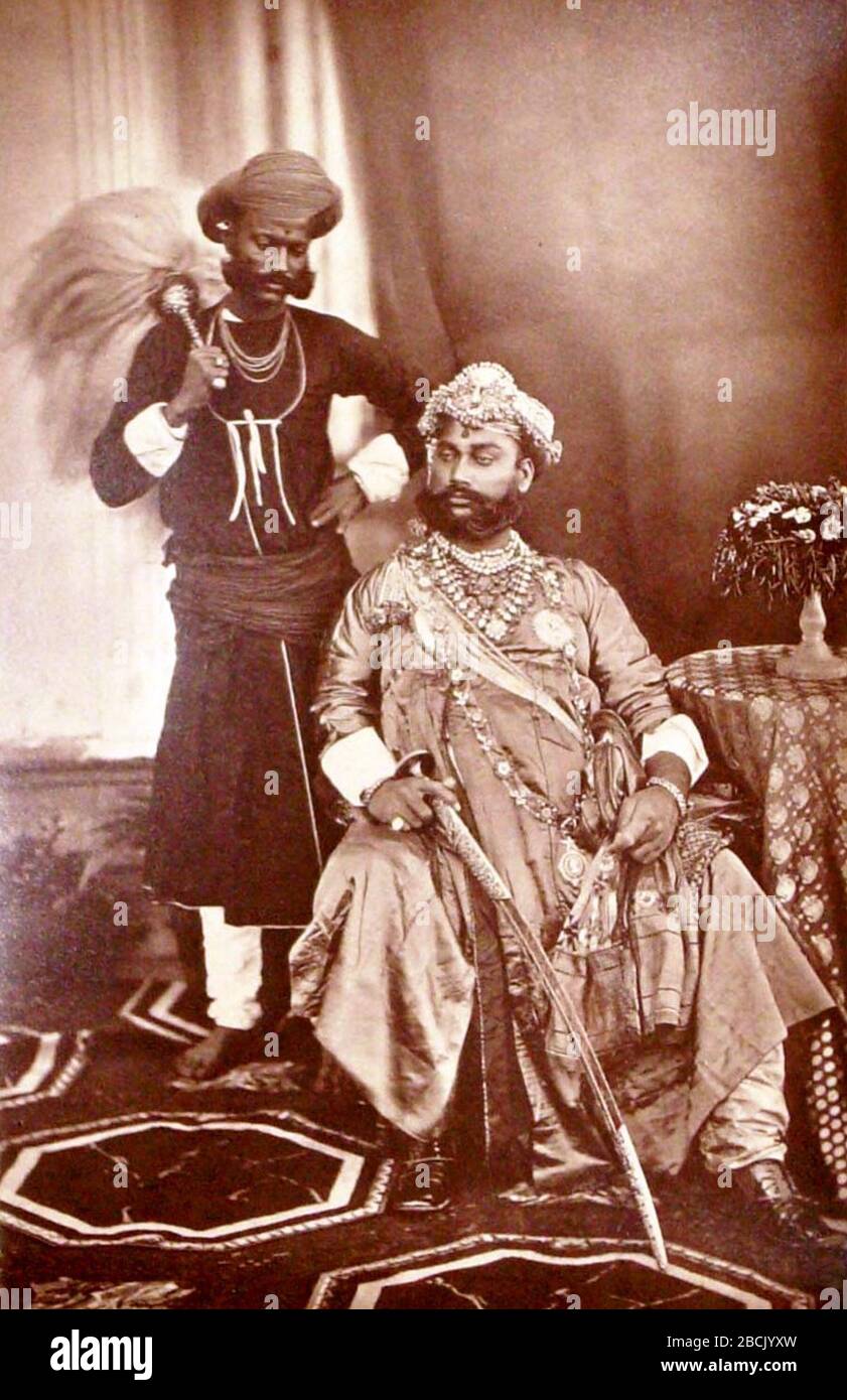 'Tukojirao II,The Maharaja Holkar of Indore seated in 1877 with his attendant; 1877; PHOTOS BY BOURNE & SHEPHERD FROM THE DELHI DARBAR OF 1877; Samuel Bourne  (1834–1912)        Alternative names  S. Bourne  Description British photographer  Date of birth/death  30 October 1834 / 1834 24 April 1912 / 1912  Location of birth/death  Mucklestone Nottingham  Authority control  : Q337475 VIAF: 17498395 ISNI: 0000 0000 6638 7317 ULAN: 500022534 LCCN: n82235787 Open Library: OL5842150A WorldCat    creator QS:P170,Q337475; ' Stock Photo