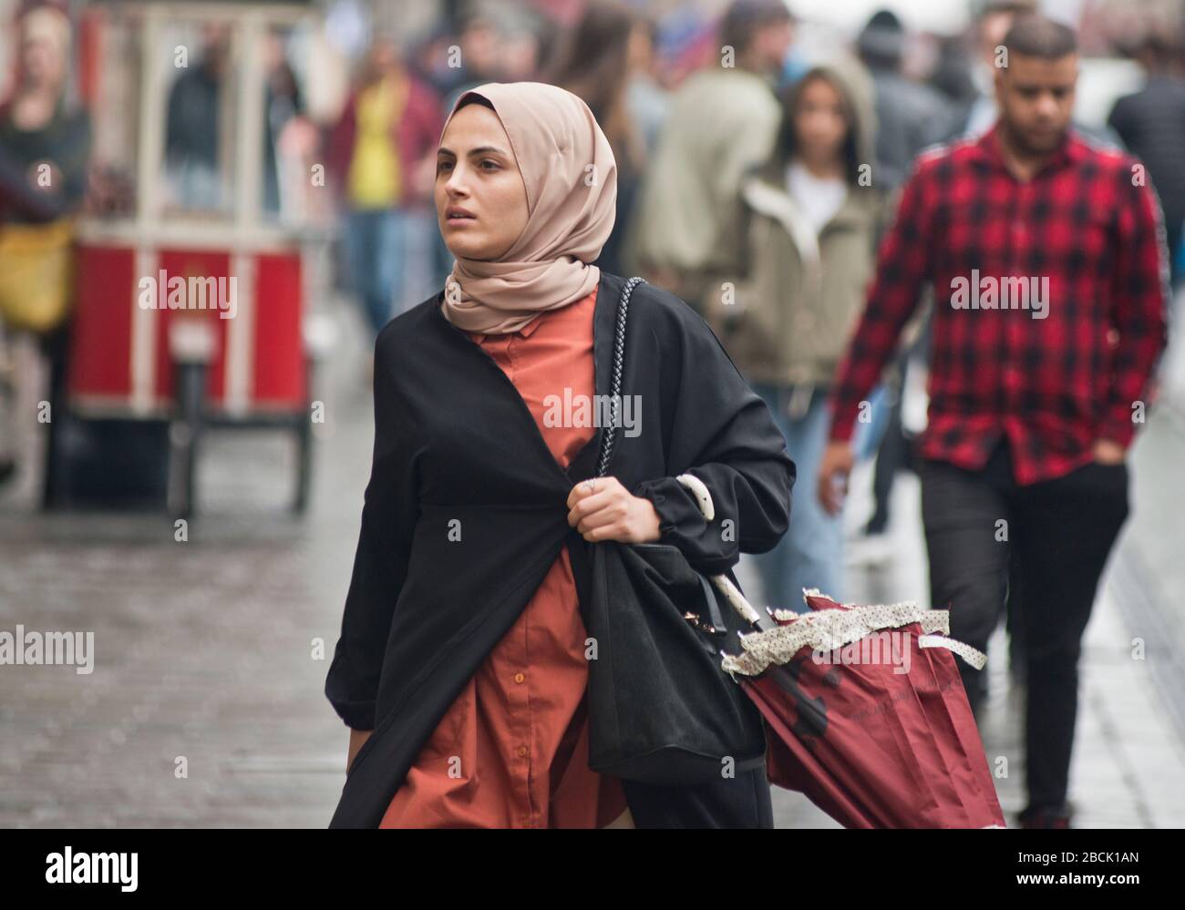 A muslim girl wearing a pashmina. Istiklal avenue, Istanbul. Turkey