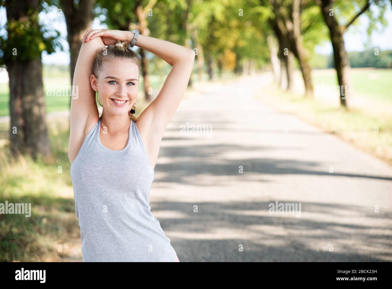 young woman stretching Stock Photo