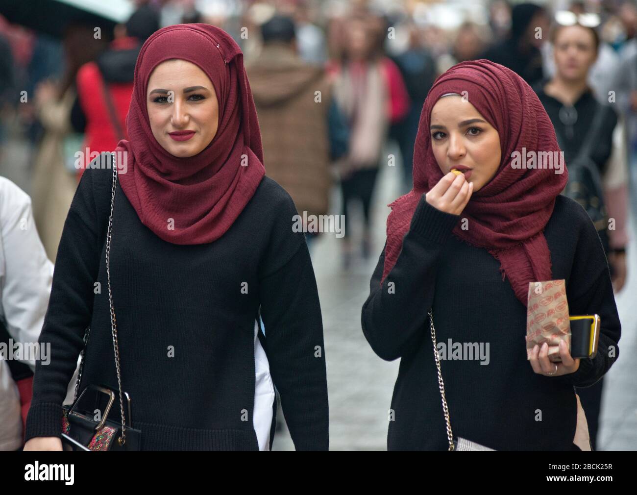 Turkish women wearing matching pashminas in Istiklal avenue, Istanbul. Turkey Stock Photo