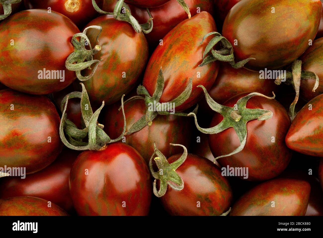 kumato plum tomato macro closeup Stock Photo