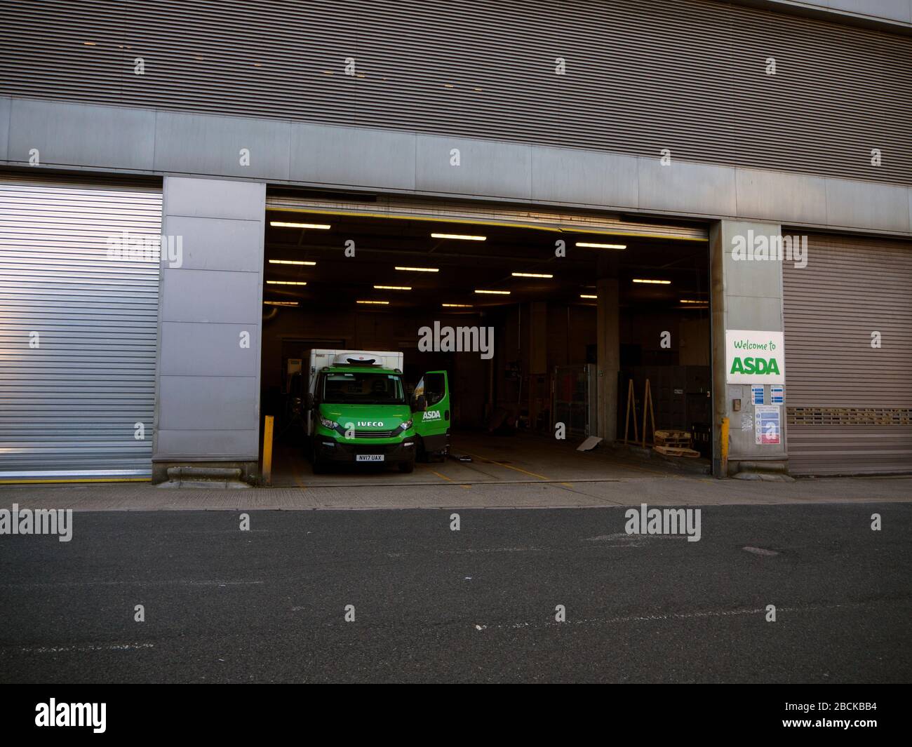 ASDA home delivery vans parked up at ASDA store loading bay Stock Photo