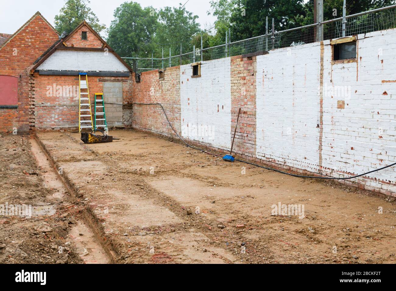 Demolition, rebuild and conversion of an outbuilding for extension of a