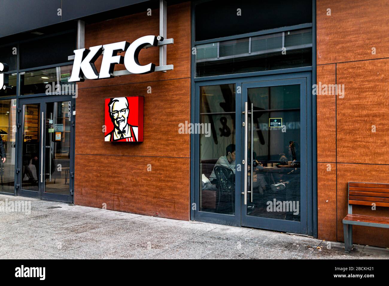 Warsaw, Poland - January 22, 2020: KFC fast food chain restaurant with logo sign by entrance near Centrum city center in Warszawa Stock Photo
