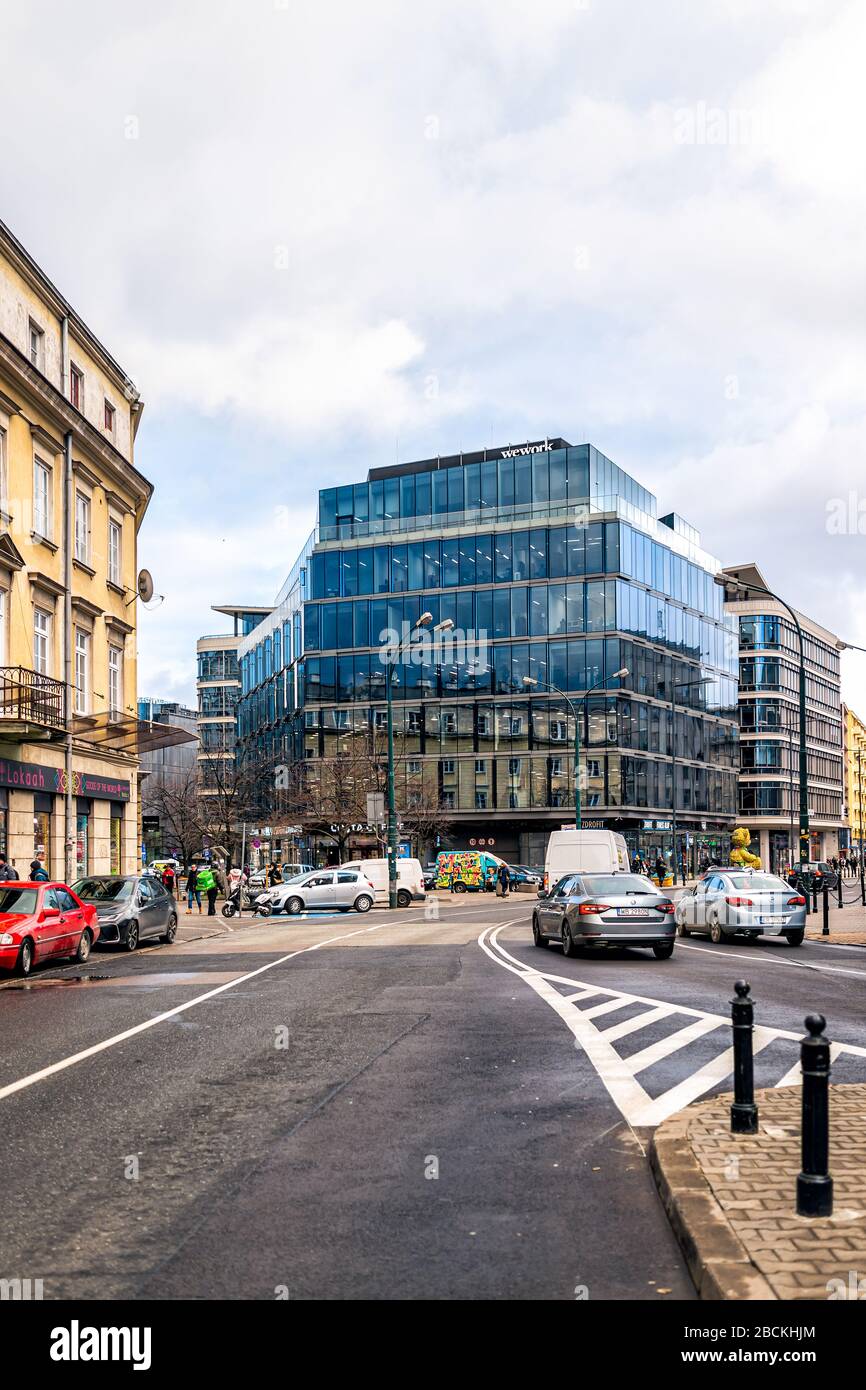 Warsaw, Poland - January 22, 2020: Wework co-working office space building in downtown center of Warszawa with outside outdoor view on street road Stock Photo