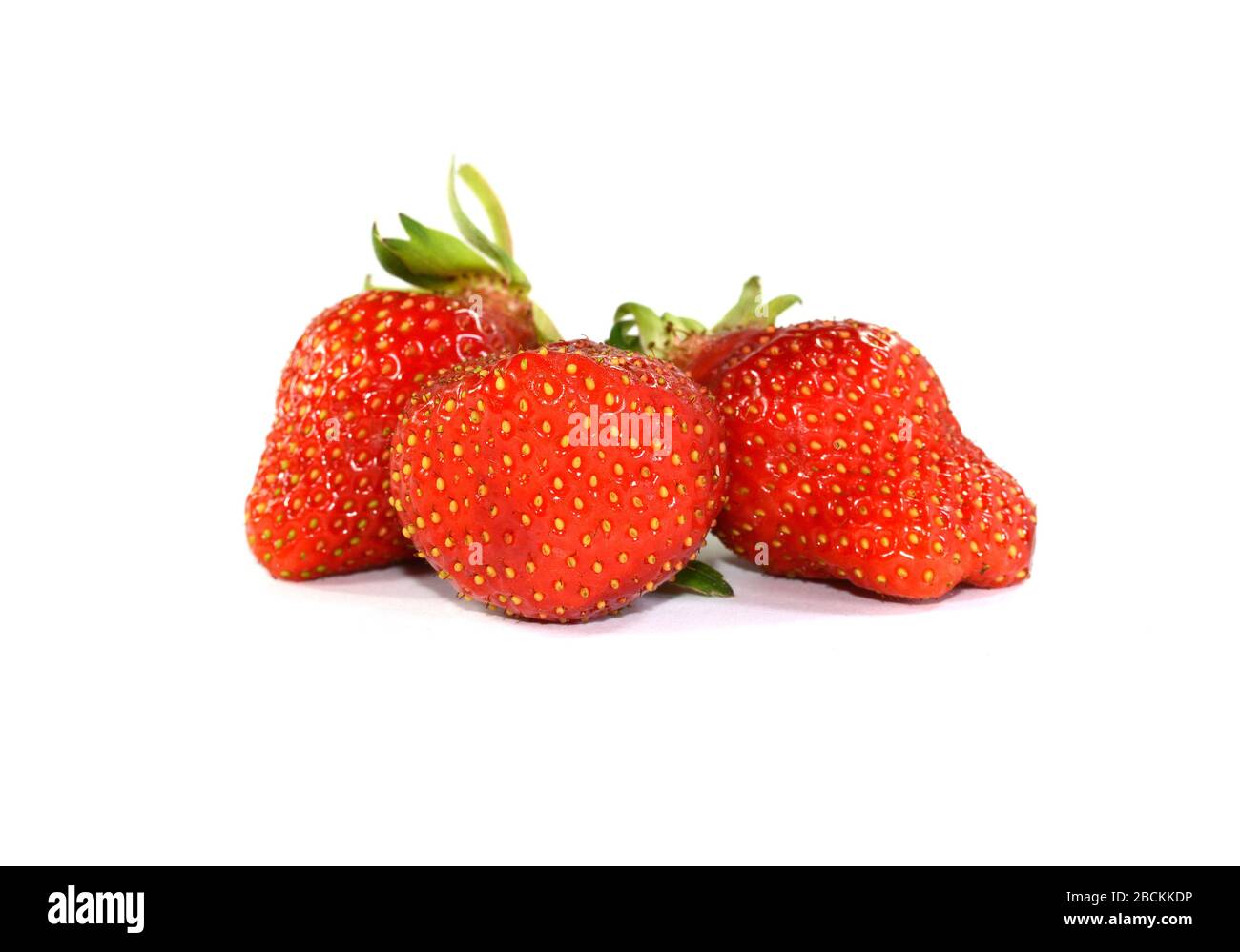 Strawberries isolated on a white background Stock Photo - Alamy