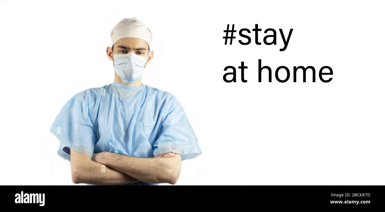 Doctor in surgical mask calling # Stay home. Covid-19. Stay at home. Self-isolation. Stay at home conception. QuarantineBanner. Place for text Stock Photo