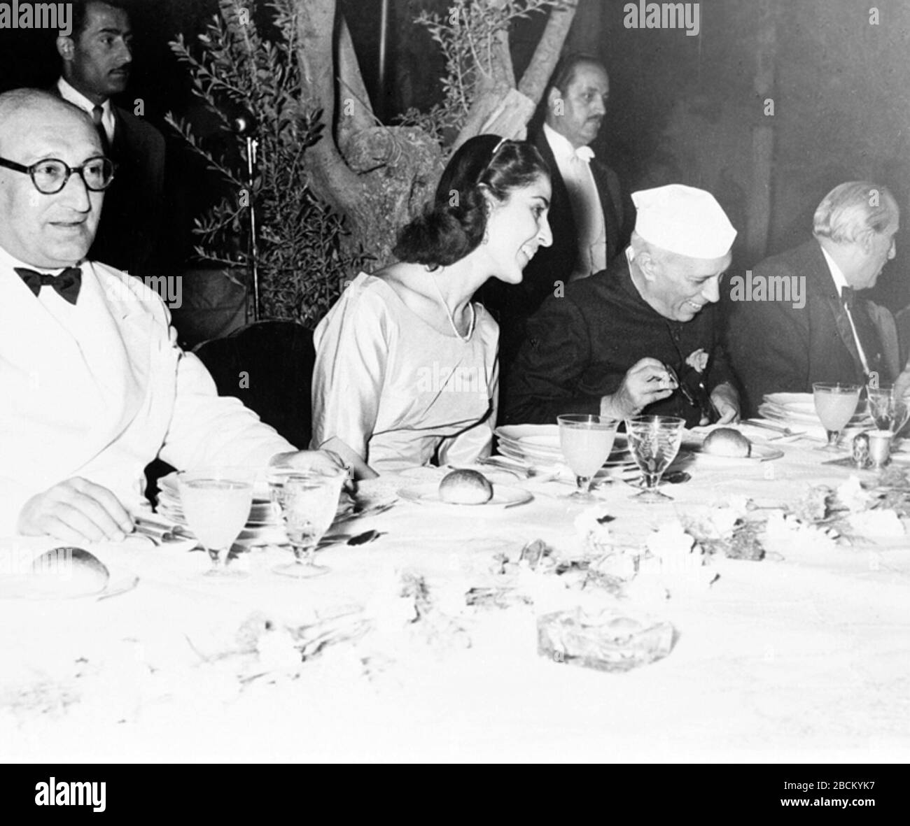 'English: E.A.Min./June,1956,A22a(i)Photograph taken at the banquet given in honour of the Prime Minister, Shri Jawaharlal Nehru, by H.E. Shukri Kuwatly, President of Syria, at Damascus during the Prime Minister’s visit to Syria in June, 1956.L to R:- H.E. Sabri Assali, Syrian Prime Minister, Miss Huda Kuwatly, the daughter of the Syrian President; the Prime Minister, Shri Jawaharlal Nehru; H.E. Shukri Kwatly and Smt. Indira Gandhi.; June 1956; http://photodivision.gov.in/writereaddata/webimages/thumbnails/52331.jpg; Photo Division, Ministry of Information & Broadcasting, Government of India; Stock Photo