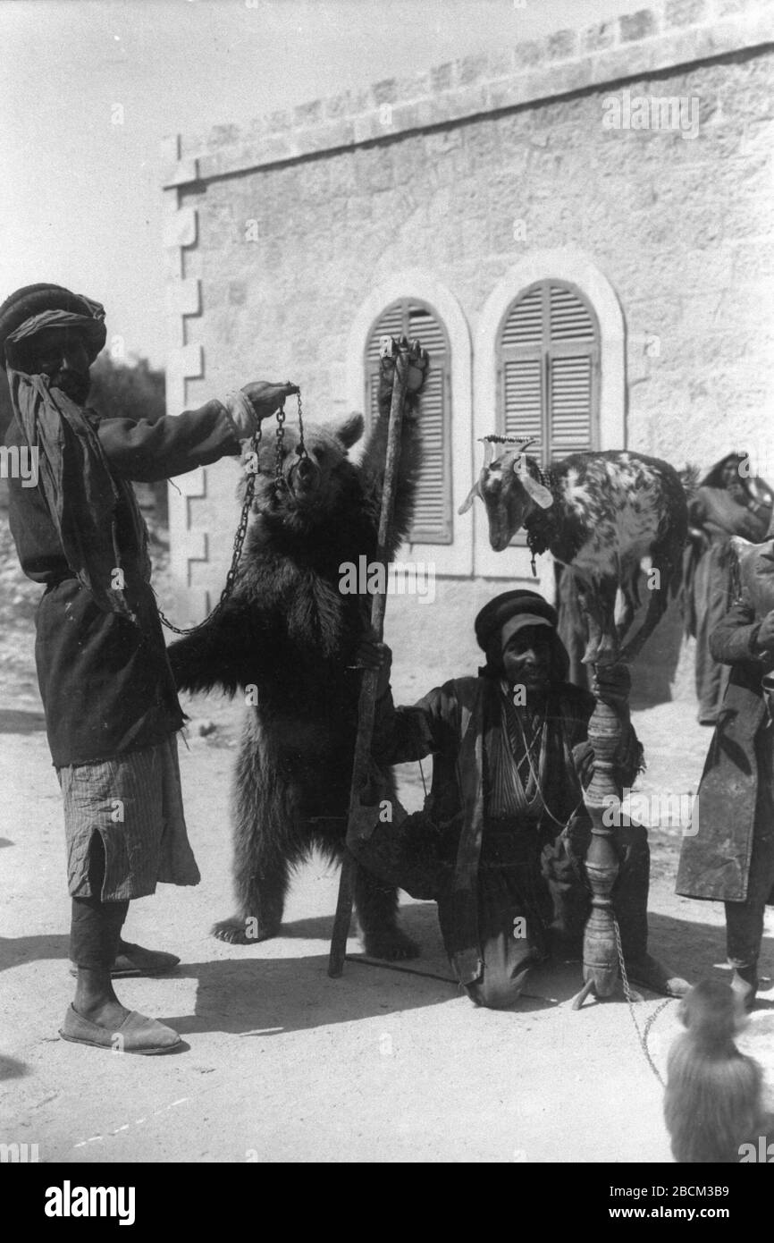 English Street Circus Performing In Jerusalem During The Ottoman Era With A Trained Monkey Goat And Bear O U I U I O C U Ss O Ss O I E C U O O I U E I U I Ss I N I I I E E