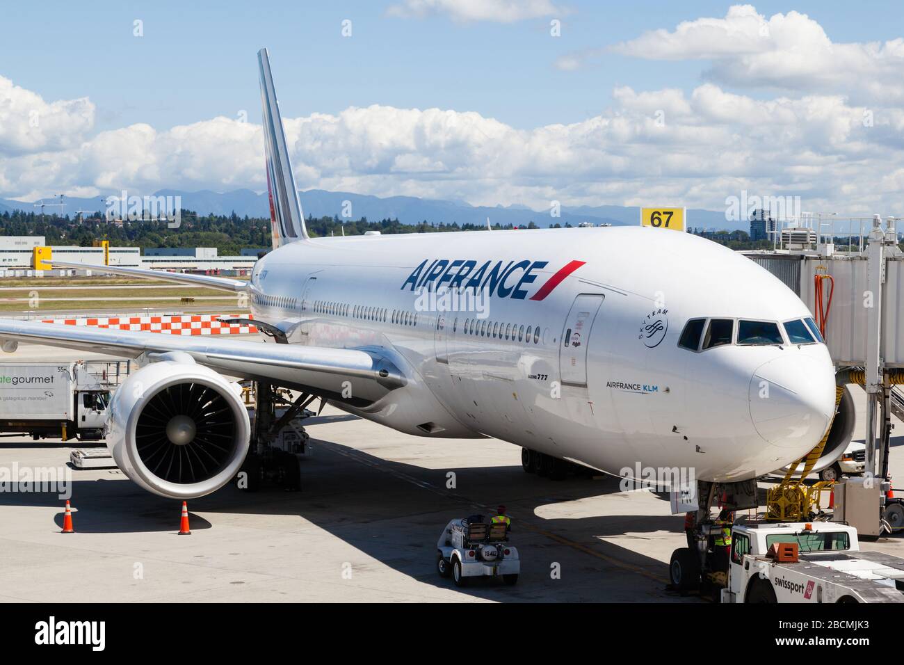 Vancouver, Canada - July 3, 2017: An Air France Airlines Boeing 777 plane being serviced on the tarmac of Vancouver International Airport. Stock Photo