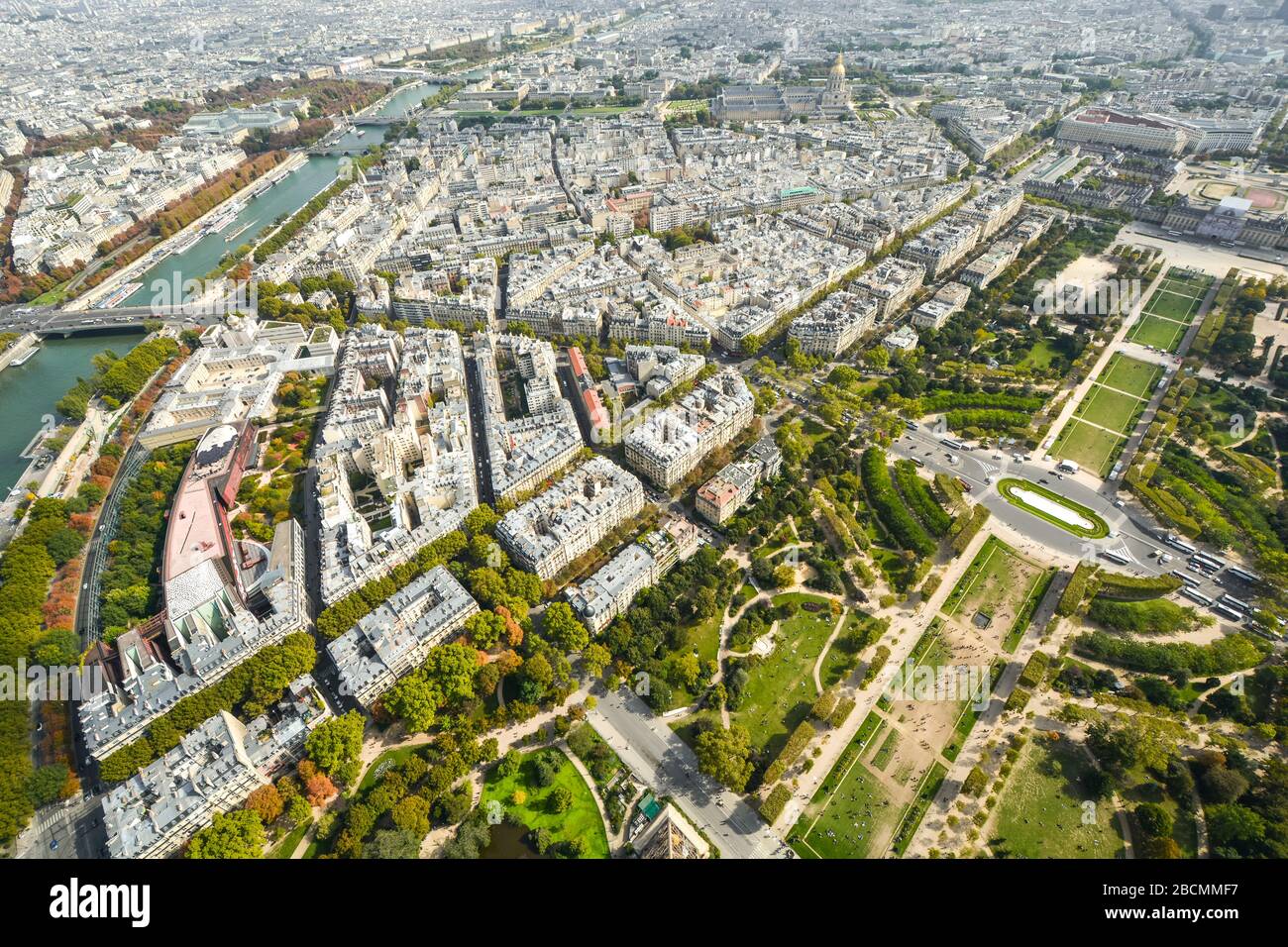 Overhead view from the Eiffel Tower platform of the city of Paris France with the Seine river, Champ de Mars park and Ecole Militaire in view. Stock Photo