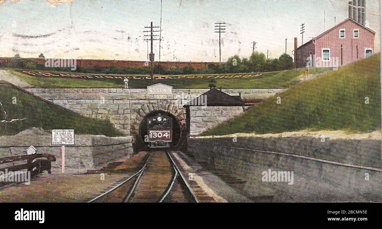 'English: Postcard of the west end St. Clair River Tunnel in Port Huron, Michigan, United States. The east end is in Sarnia, Ontario, Canada.  The tunnel was designated a Civil Engineering Landmark by both the Canadian and the American Societies of Civil Engineers (CSCE and ASCE) in 1991.  The tunnel is a designated US National Historic Landmark, and is listed on the US National Register of Historic Places (NRHP).NRHP reference number 70000684; circa 1907 date QS:P,+1907-00-00T00:00:00Z/9,P1480,Q5727902; Self-scanned; Unknown author; ' Stock Photo