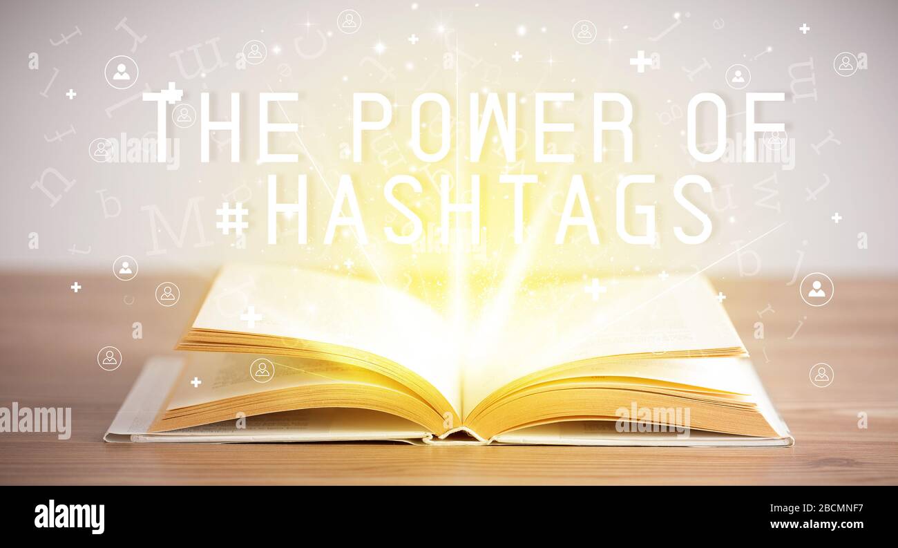 Open book with THE POWER OF #HASHTAGS inscription, social media concept Stock Photo