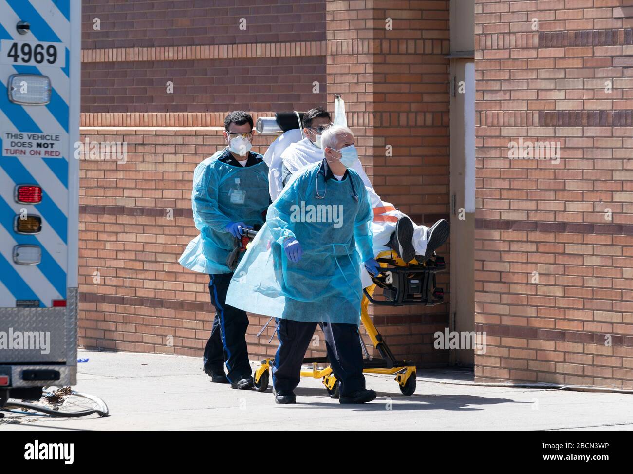 New York, NY April 4, 2020 EMT members bring sick patient to