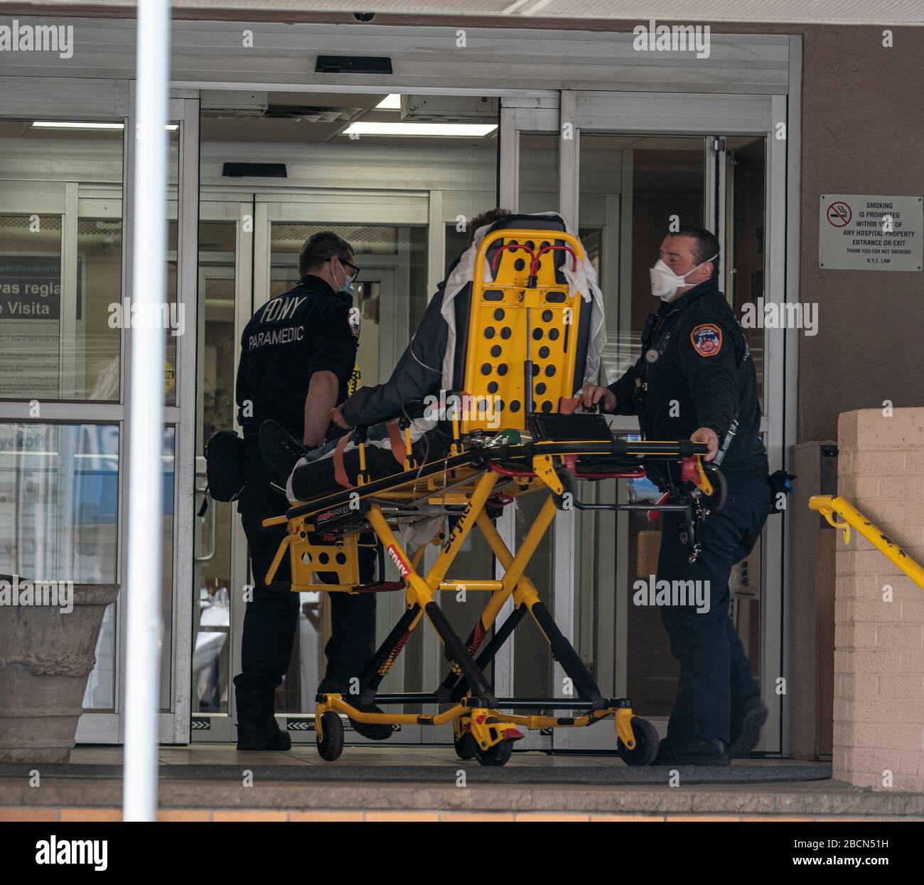 New York, NY April 4, 2020 EMT members bring sick patient to
