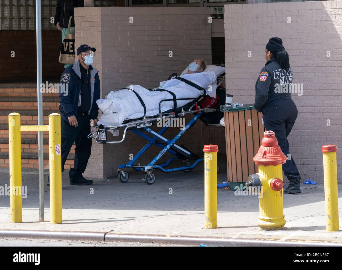 New York, NY April 4, 2020 EMT members bring sick patient to